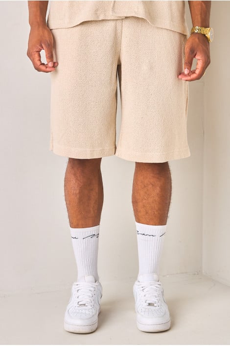 Short beige en tissu texturé et ajouré